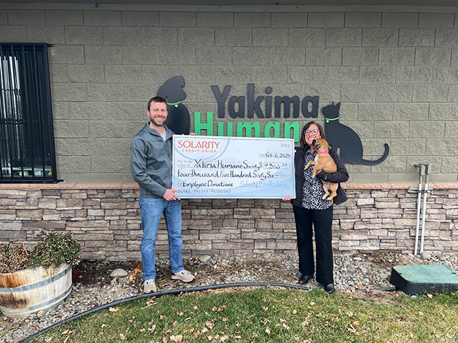 Solarity president and CEO Mina Worthington presenting donation to Yakima Humane Society