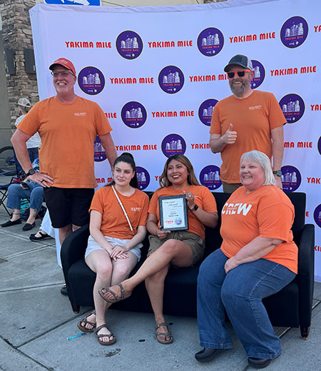 Solarity employees accepting Emily Harris Award